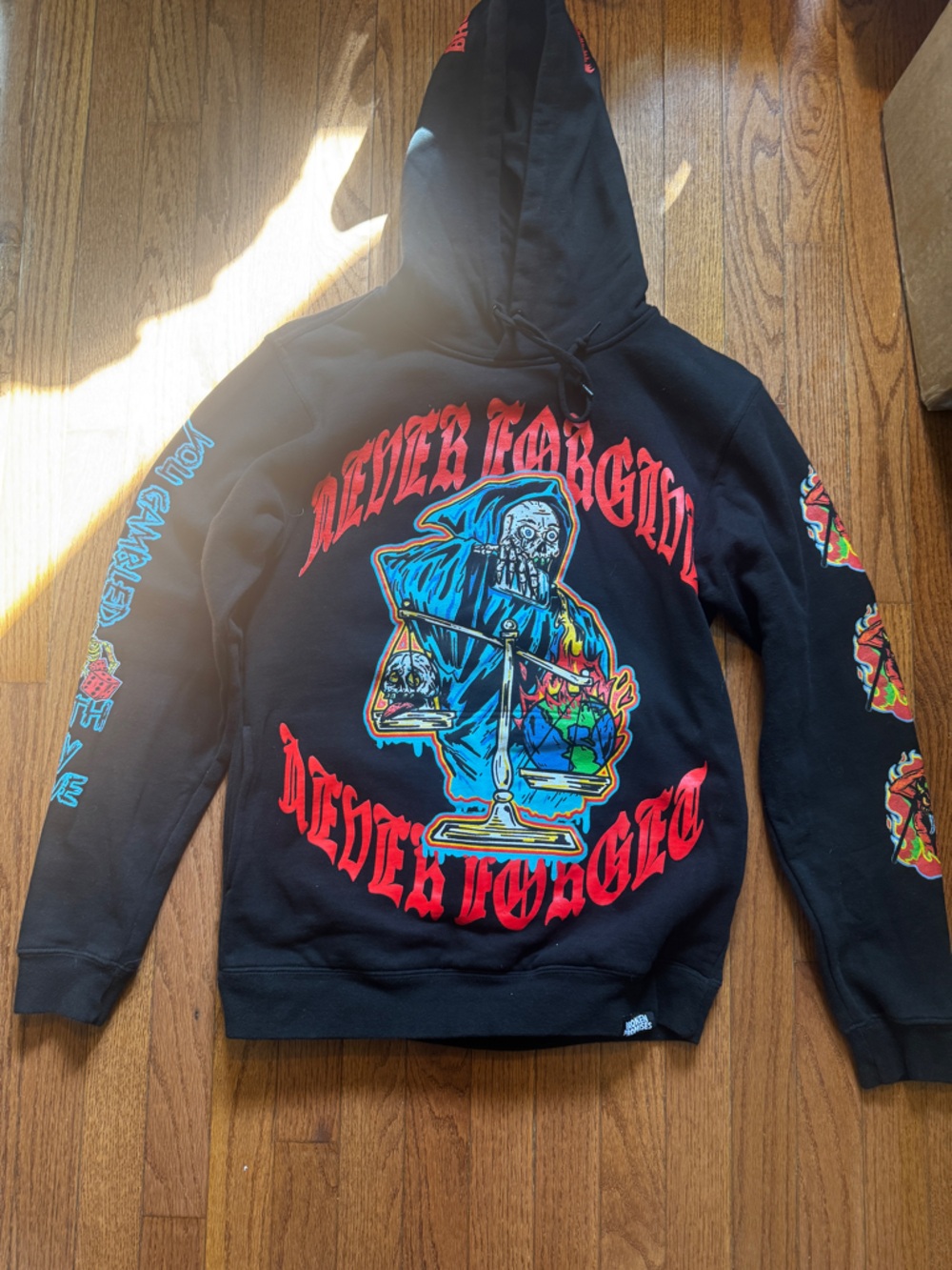 Broken Promises Graphic Reaper Hoodie with Bold Red Lettering